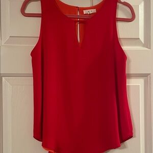 Red Sleeveless Blouse
Lining is vibrant orange